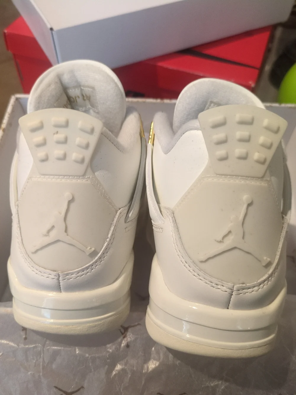 Air Jordan Women's All-White Sneakers with Gold Accents